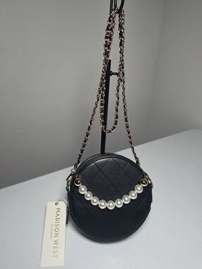 Madison West Black Quilted Round Crossbody with Pearl Detail and Gold Chain